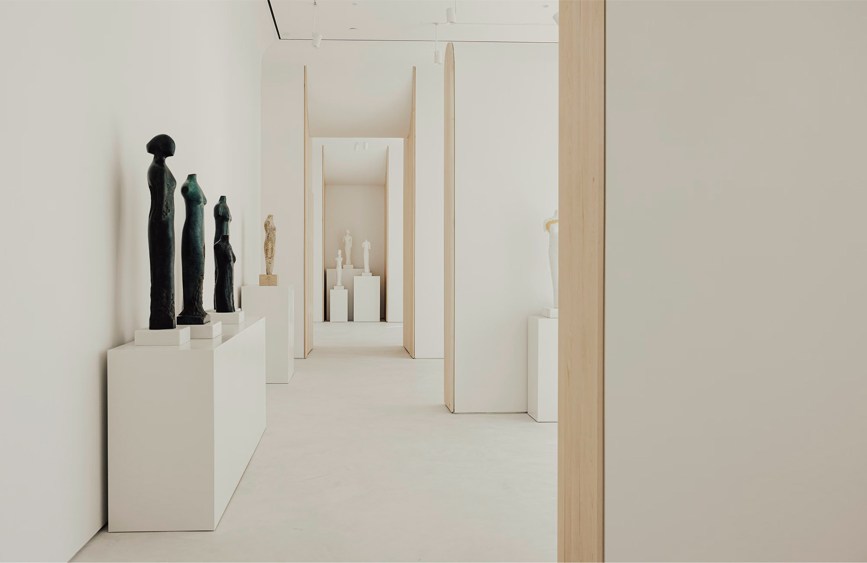 a white room with statues