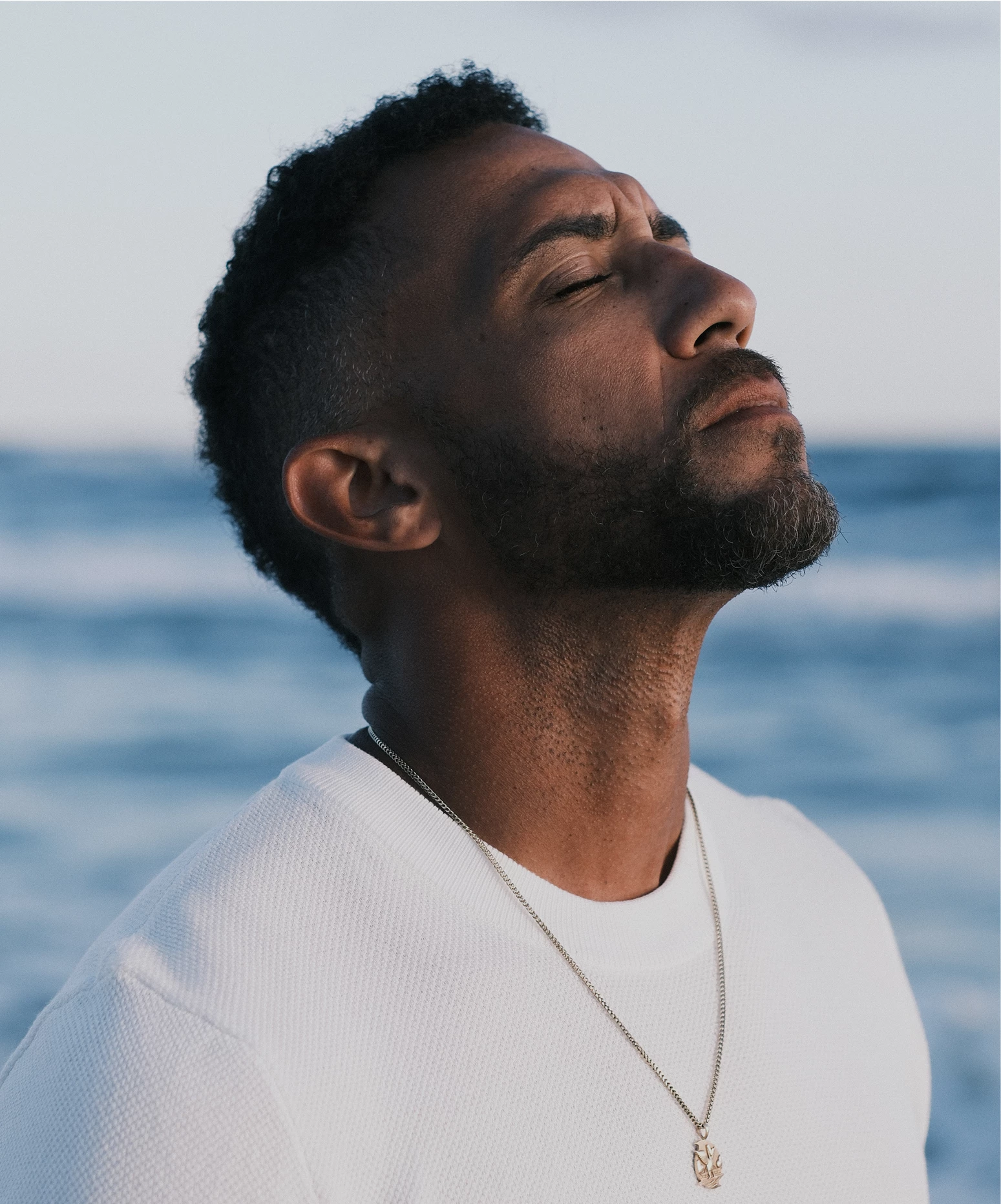 a man with his eyes closed