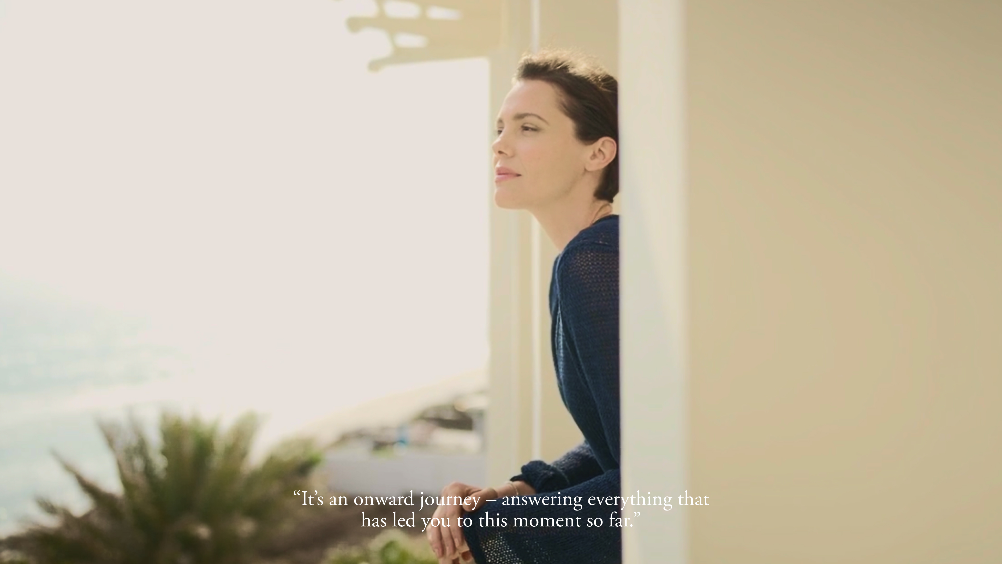 a woman looking out a window