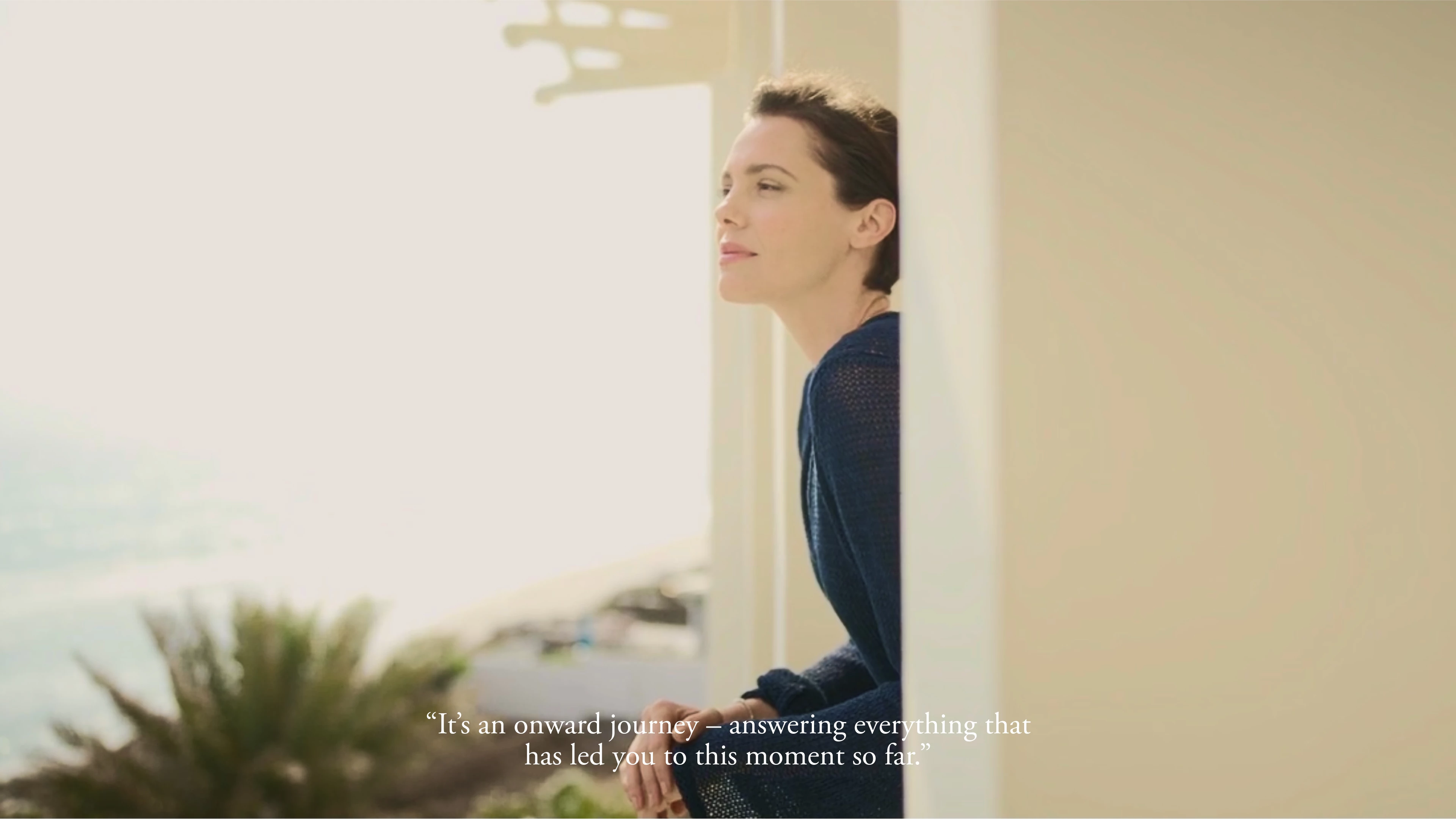a woman looking out a window