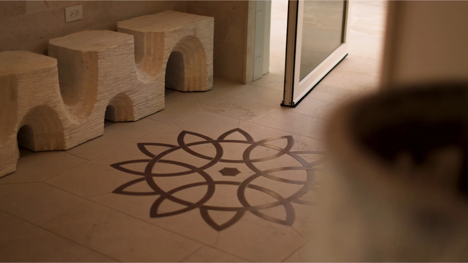a tile floor with a design on it