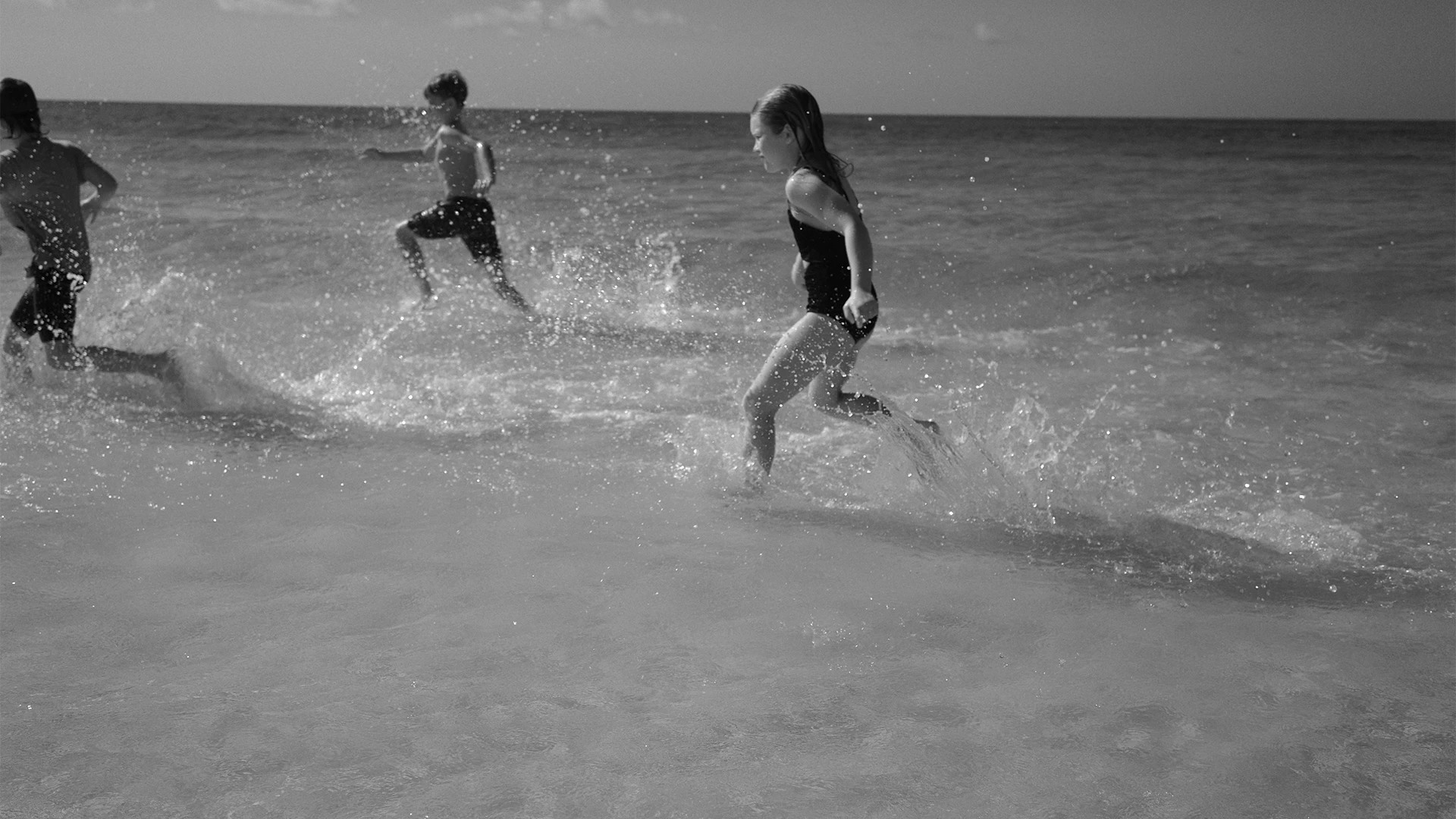 kids running in the water