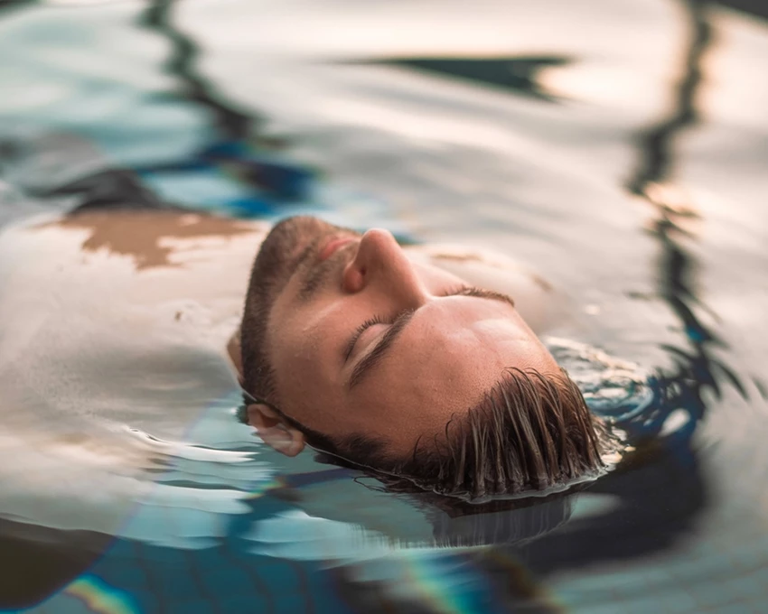 a man floating in water