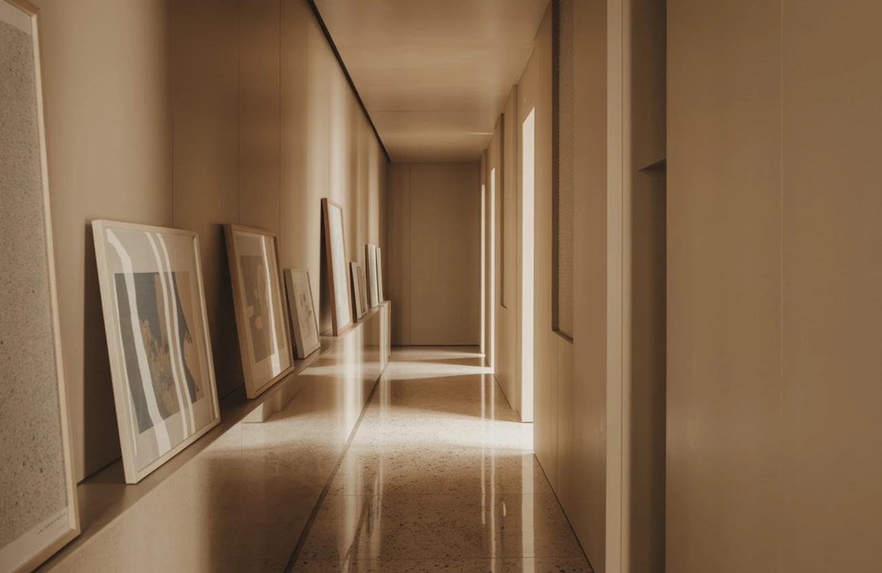 a hallway with pictures on the wall