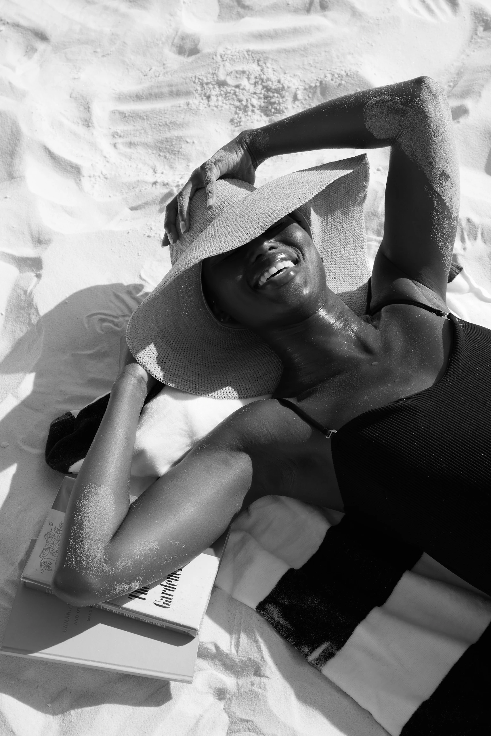 a woman lying on the sand