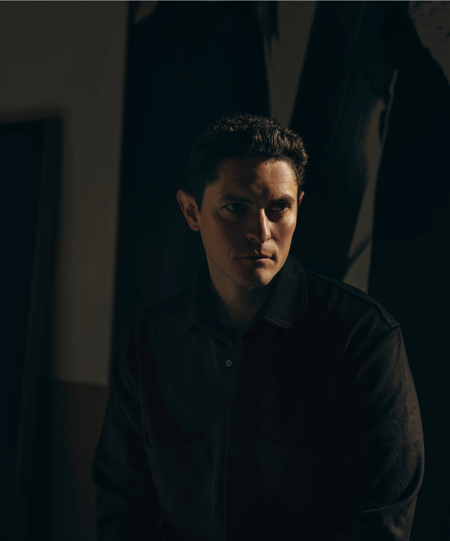 a man in a dark room