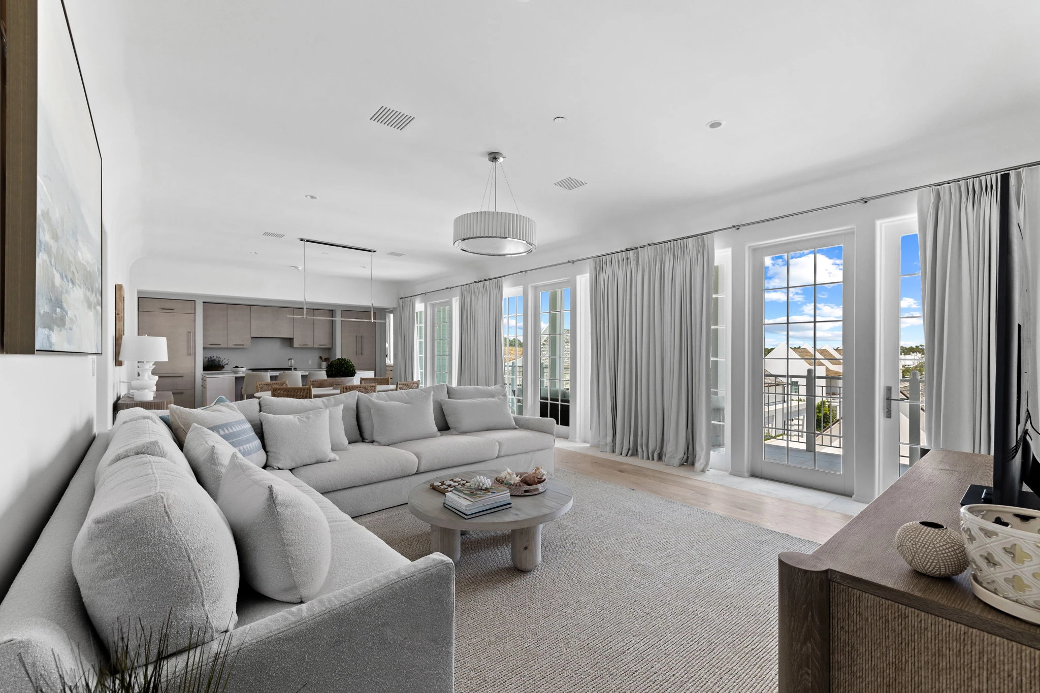 a living room with a large couch and a table