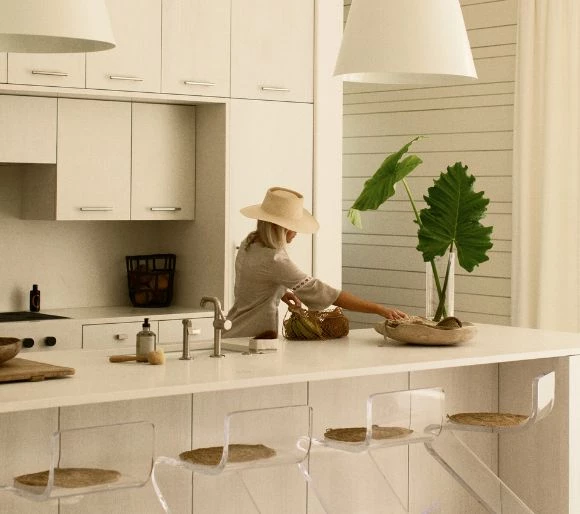 a woman in a white kitchen