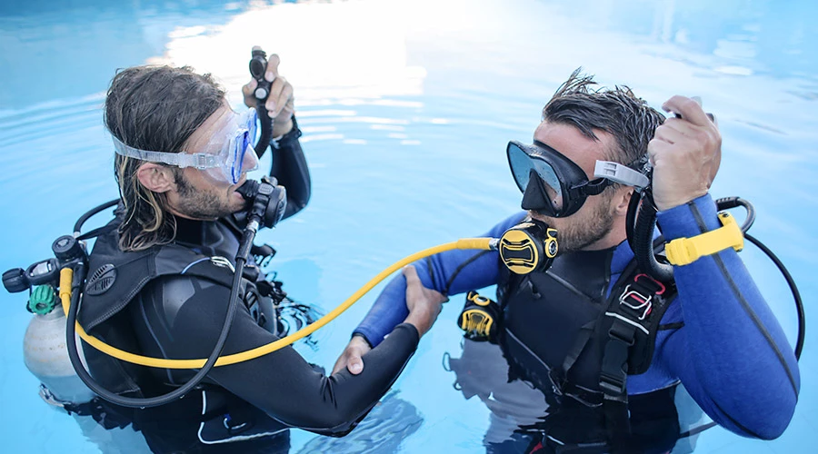 a couple of men in scuba gear