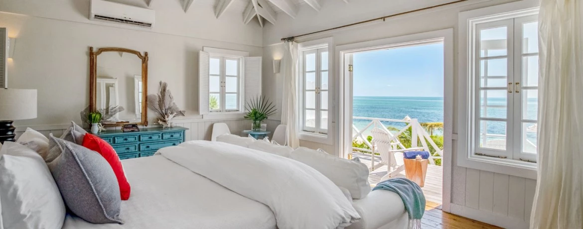 a bedroom with a large window
