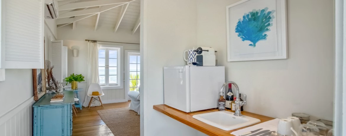 a kitchen with white walls