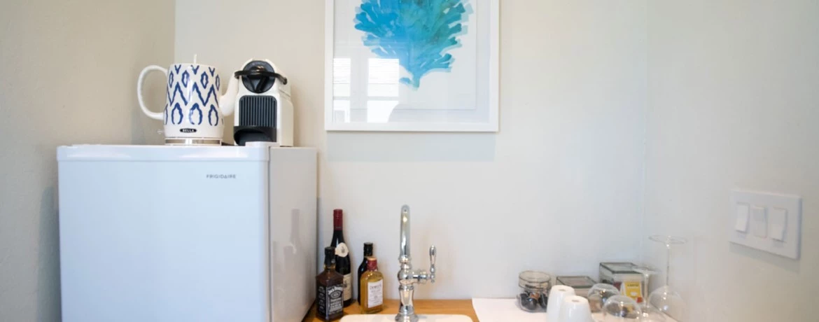 a kitchen with a sink and a refrigerator