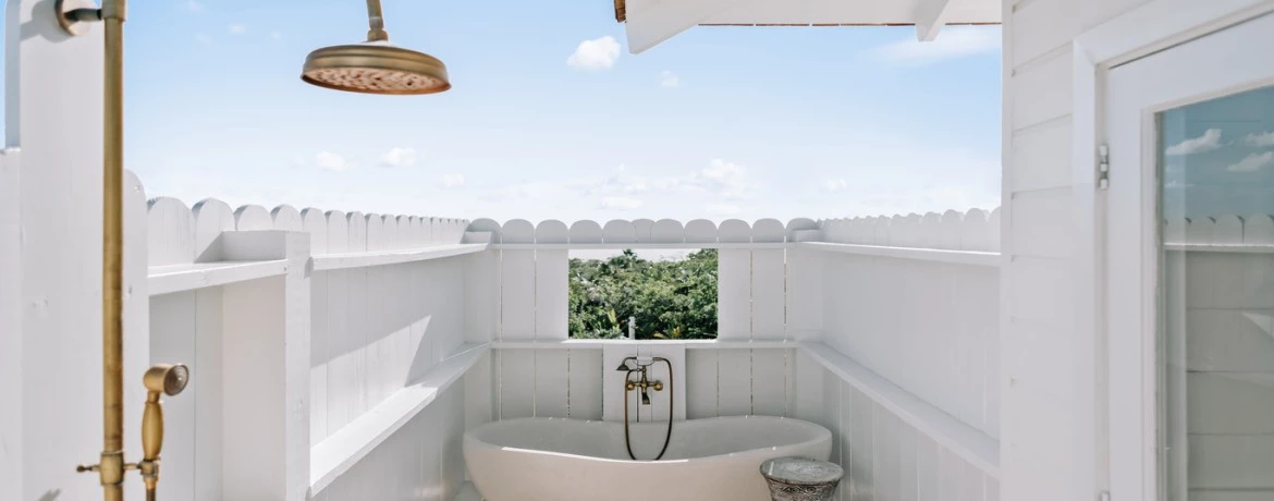 a bathroom with a tub and a sink