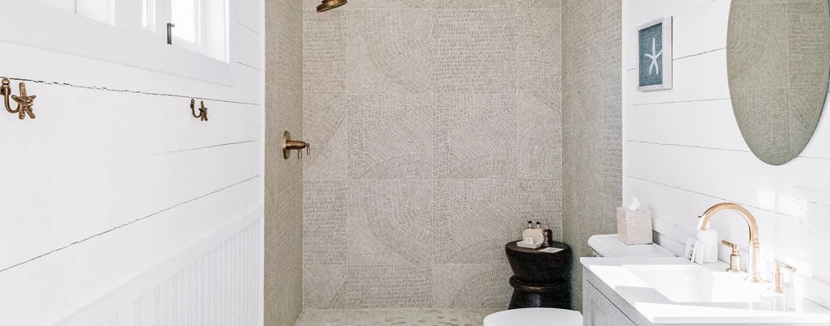 a bathroom with a sink toilet and mirror
