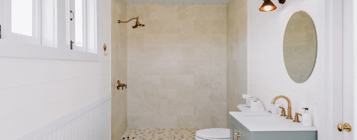 a bathroom with a sink toilet and mirror