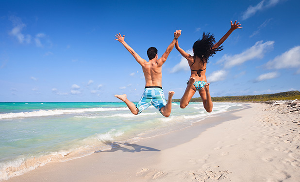a group of people jumping into water