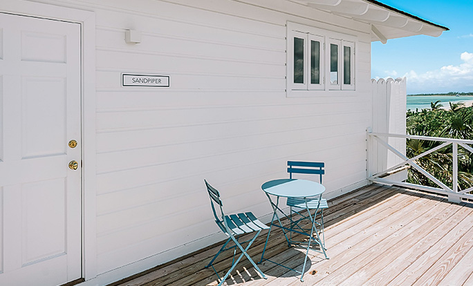 a table and chairs on a deck