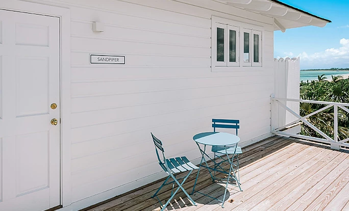 a table and chairs on a deck