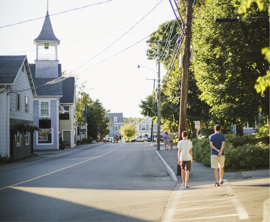 two men walking down a street