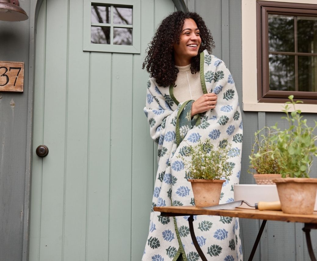 a woman standing outside a door