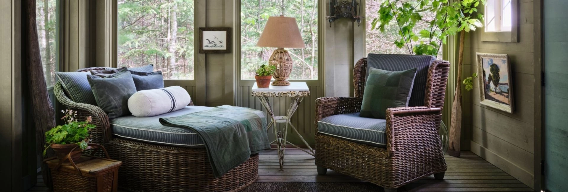 a room with wicker chairs and a lamp