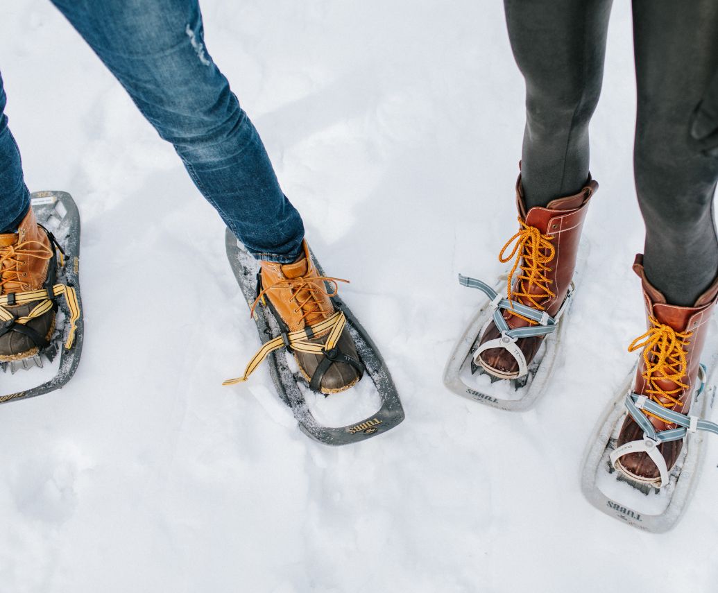 a pair of feet in snowshoes