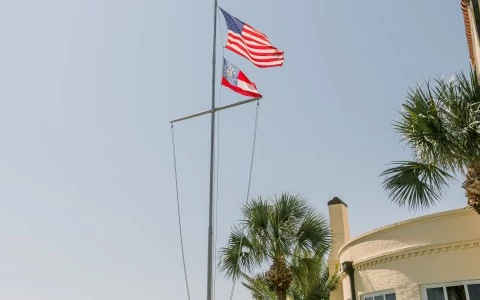 american flag pole outside hotel