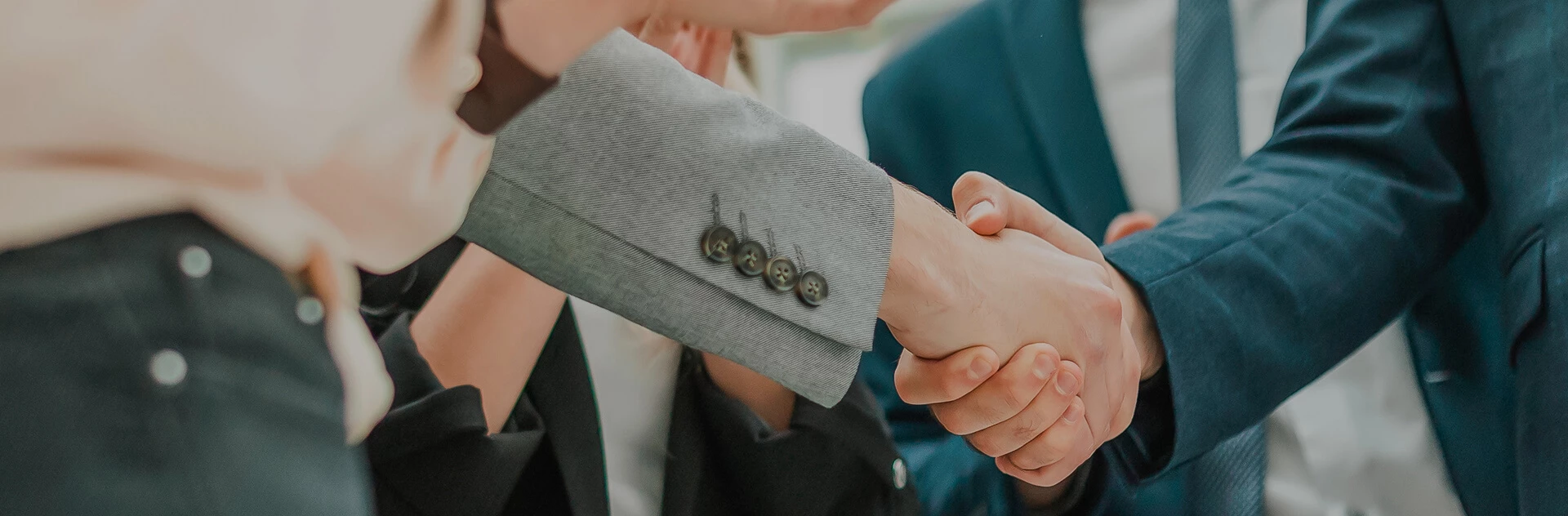 Closeup of two people shaking hands