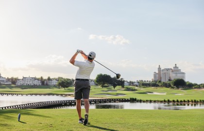 a man swinging a golf club
