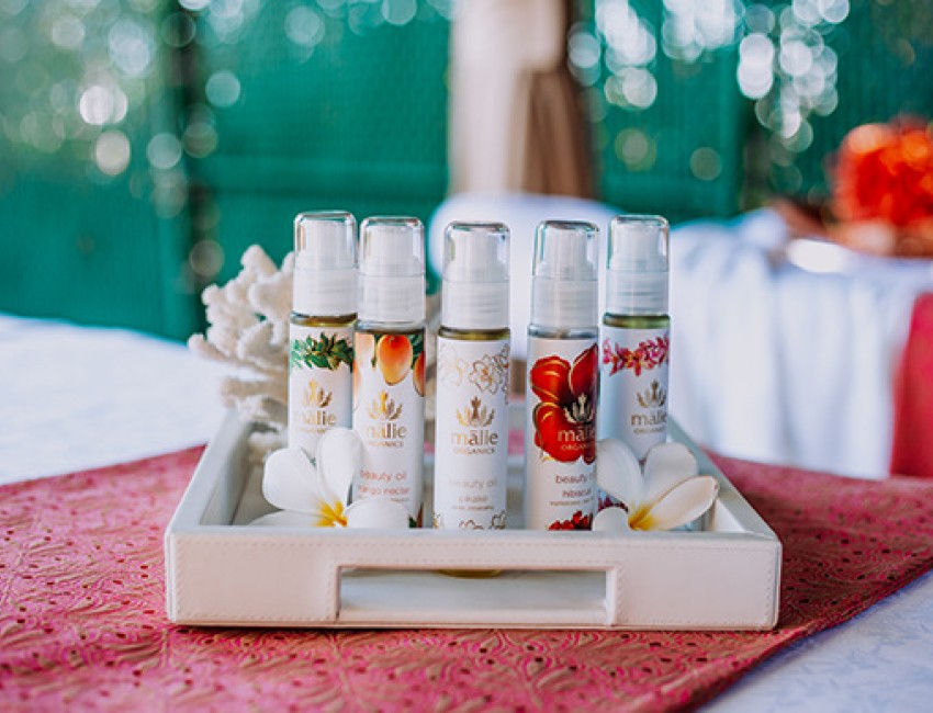 various spa products in a white tray on top of a spa bed