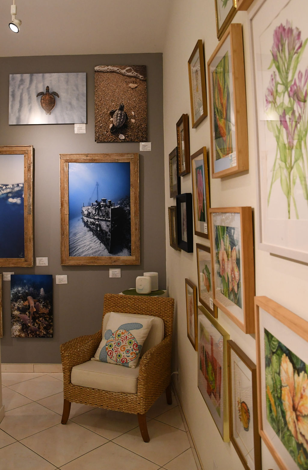 a room with a chair and pictures on the wall