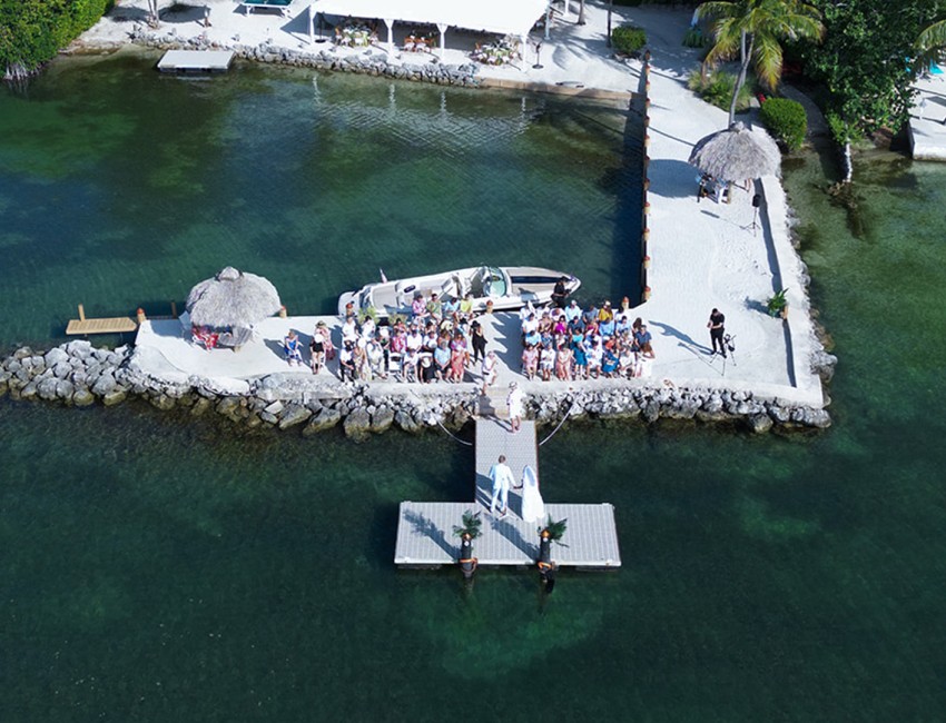 a group of people standing on a dock