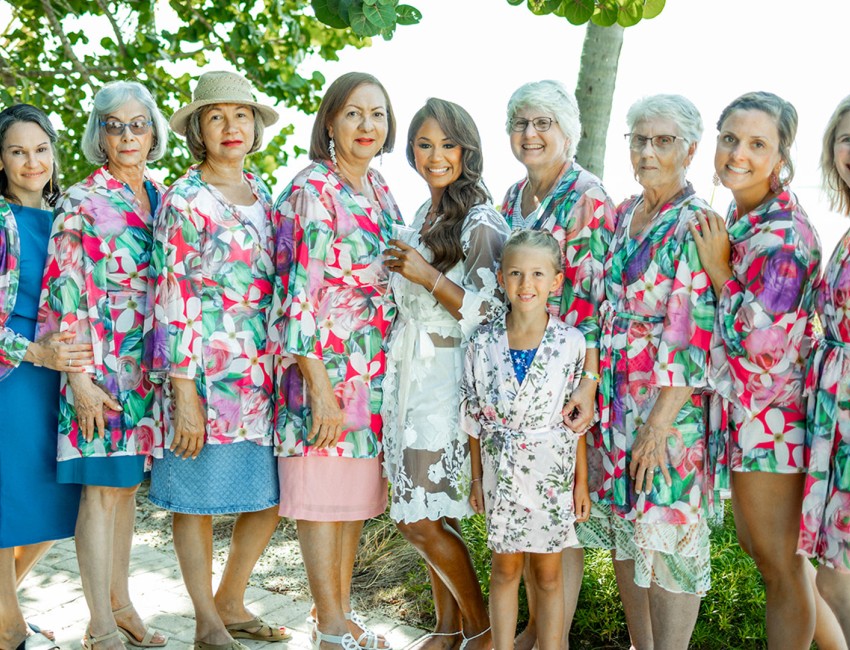 a group of women and a girl posing for a photo