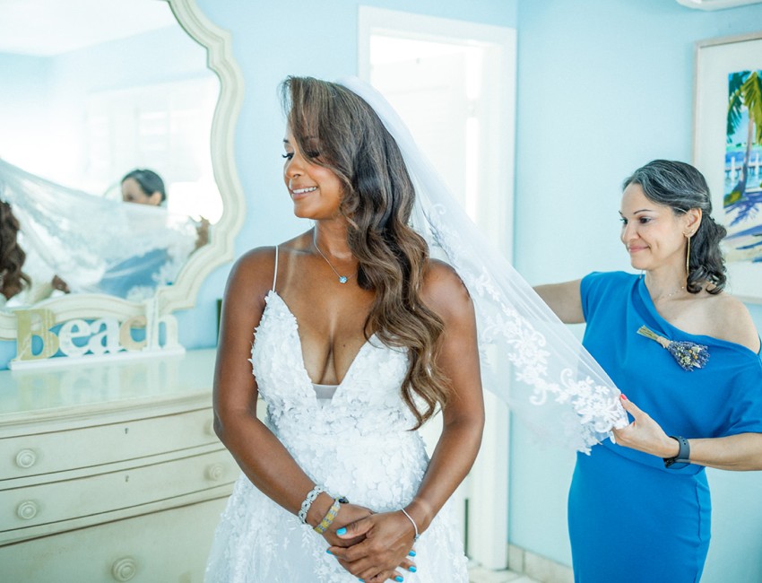 a person in a white dress and a person in a blue dress