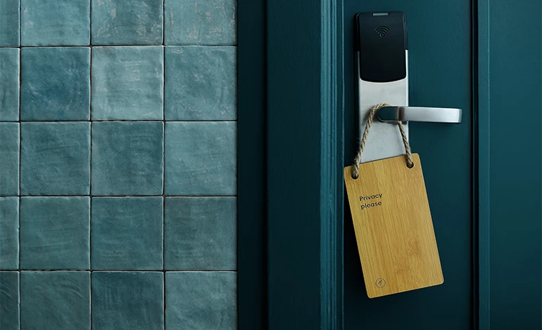 a door handle with a sign on it