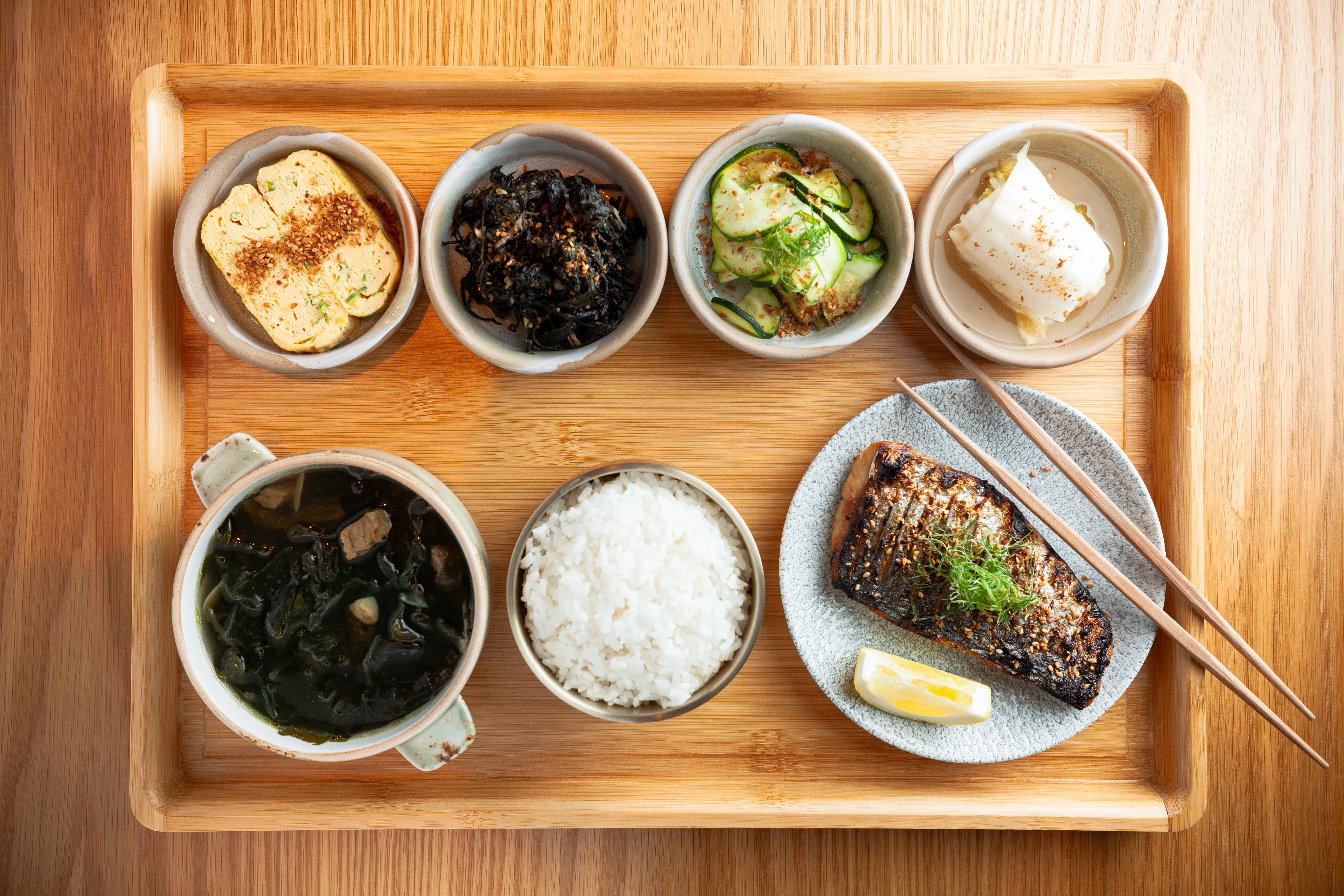 a tray of food on a wooden surface