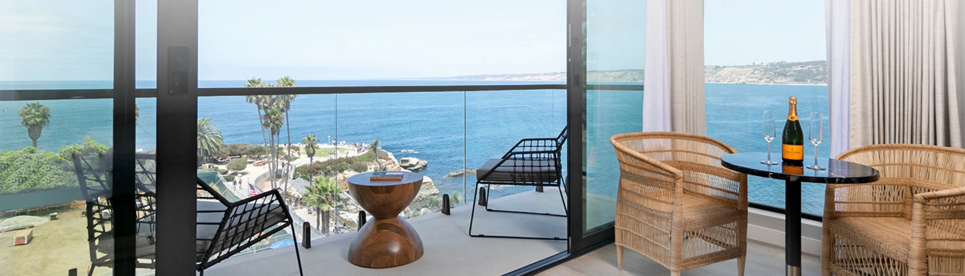 a chair and table overlooking a body of water