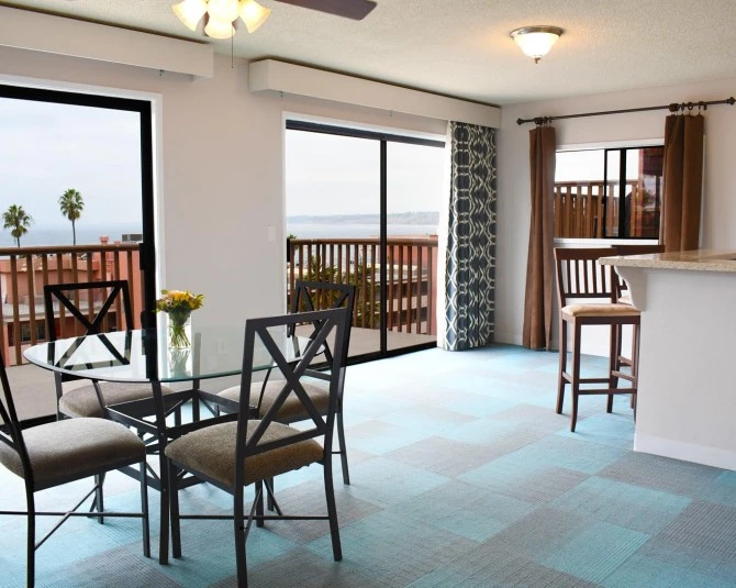 dining area with large windows with a view of the water picture 1
