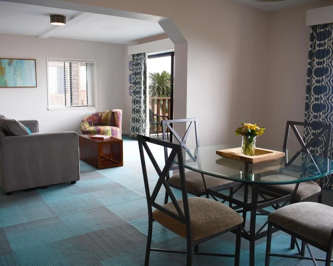 hotel room with separate dining and living room picture 2