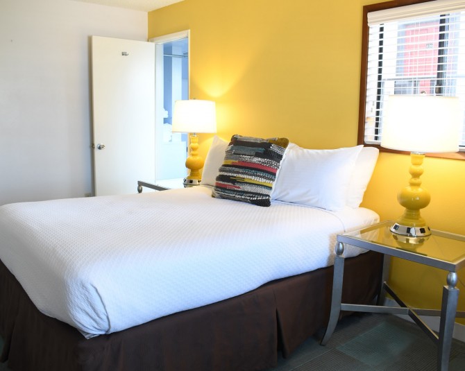 hotel room with bright yellow wall picture 0