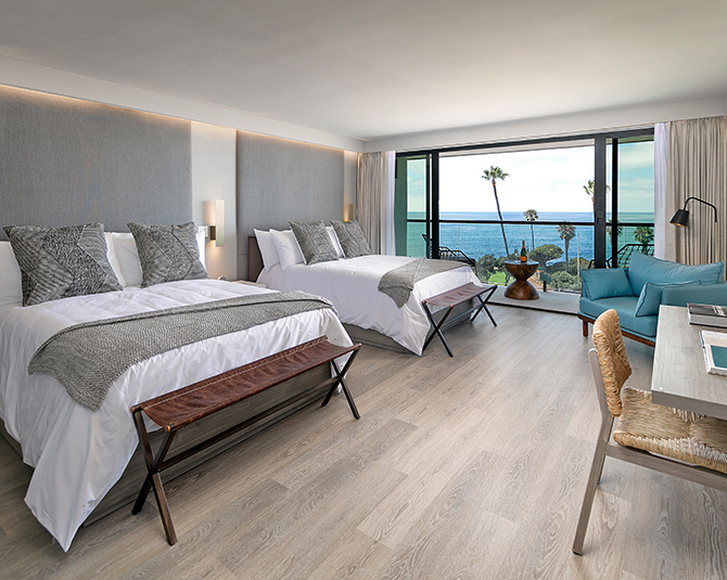 a hotel room with two beds
