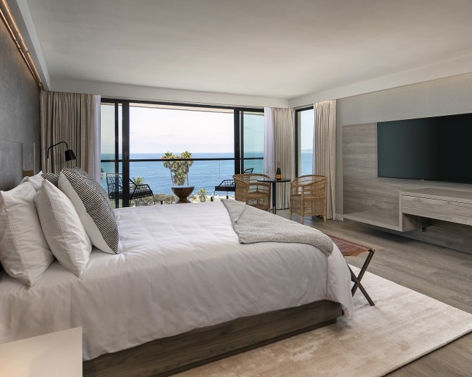 king bed with flat-screen TV and ocean view picture 0