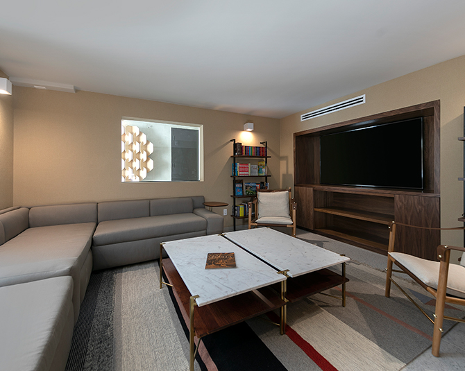 a living room with a tv and couches
