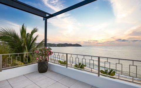 a balcony overlooking a body of water
