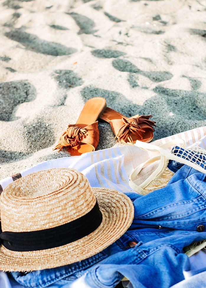 a person lying on the ground with a hat and a hat
