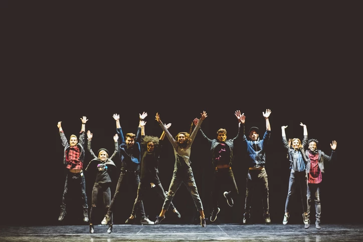 actors jumping on stage