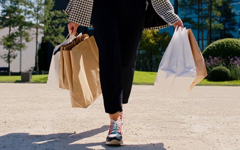 a person holding shopping bags