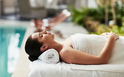 a woman lying on a towel