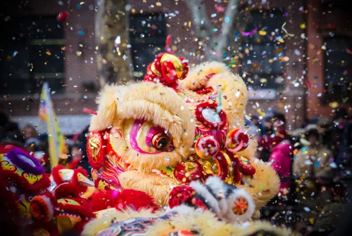 lion dance and confetti during chinese new year celebration