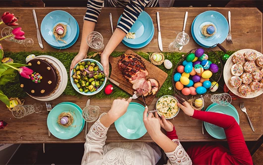 a group of people eating food at a table